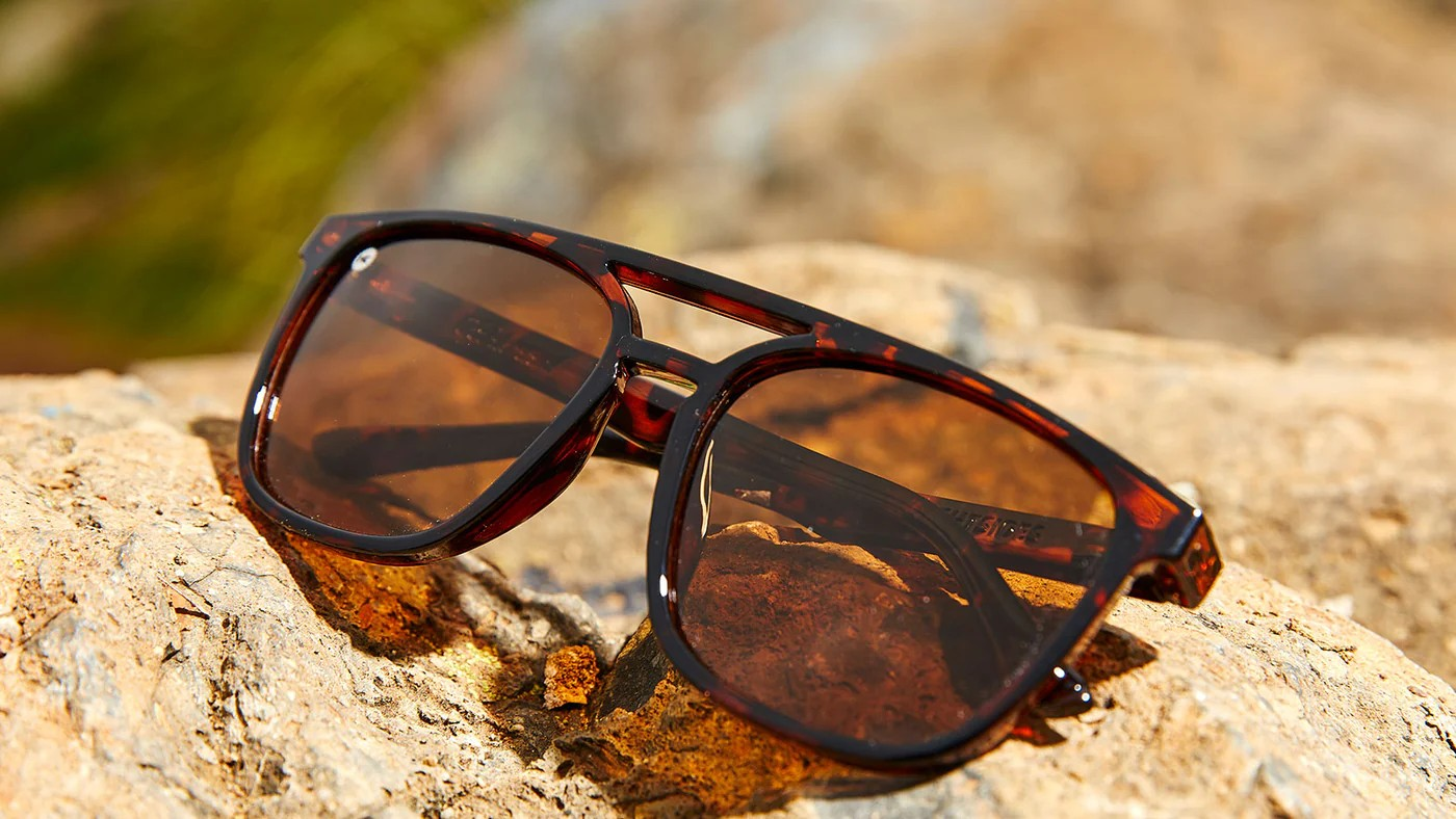 Sunglasses with Glossy Tortoise Shell Frames and Polarized Amber Lenses, Flyover