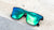 Sunglasses with a black frame with polarized green lenses, flyover