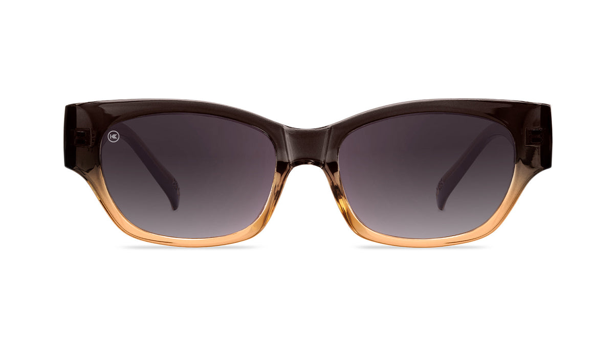 Sunglasses with a glossy muted-gray-to-peach frame and polarized smoke gradient lenses, Front