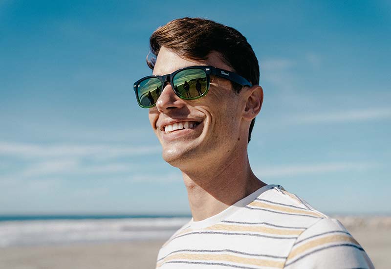 Sunglasses with Glossy Black Frames and Polarized Green Lenses, Model
