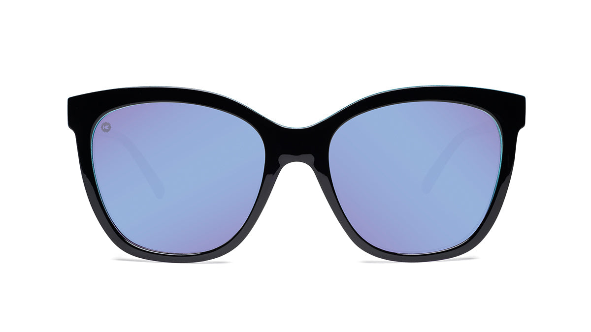 Sunglasses with Glossy Black Exterior and Ice Blue to Lavender Interior and Polarized Snow Opal Lenses. Flyover
