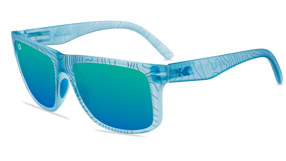 Sunglasses with blue topographic frames and polarized green lenses, flyover