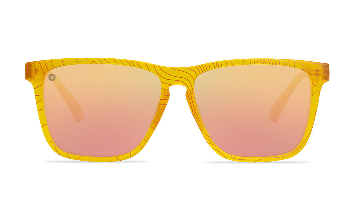 Sunglasses wtih yellow topographic frames and polarized peach lenses, flyover
